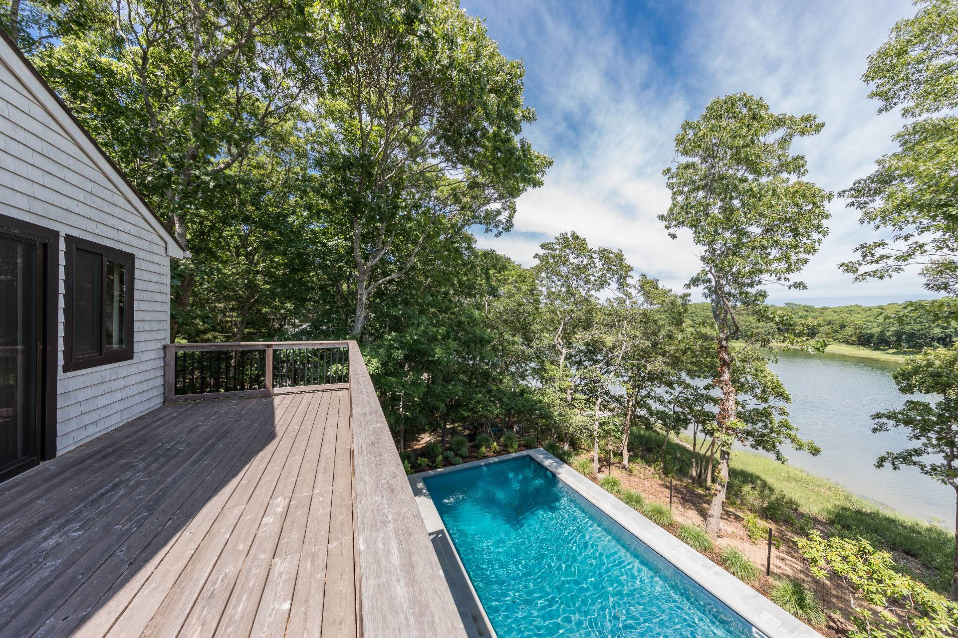 93 Isle Of Wight Road East Hampton, NY 11937 - Photo 11 of 17 a view of balcony with wooden floor and lake view