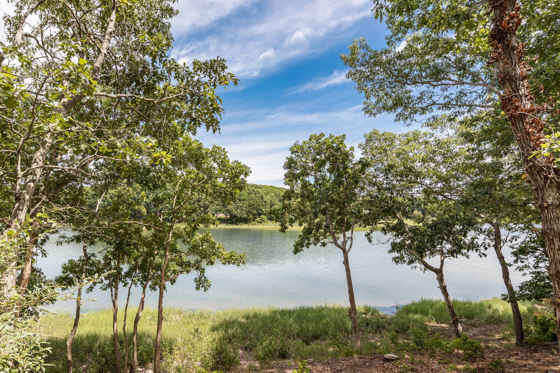 93 Isle Of Wight Road East Hampton, NY 11937 - Photo 3 of 17 a view of lake with tree