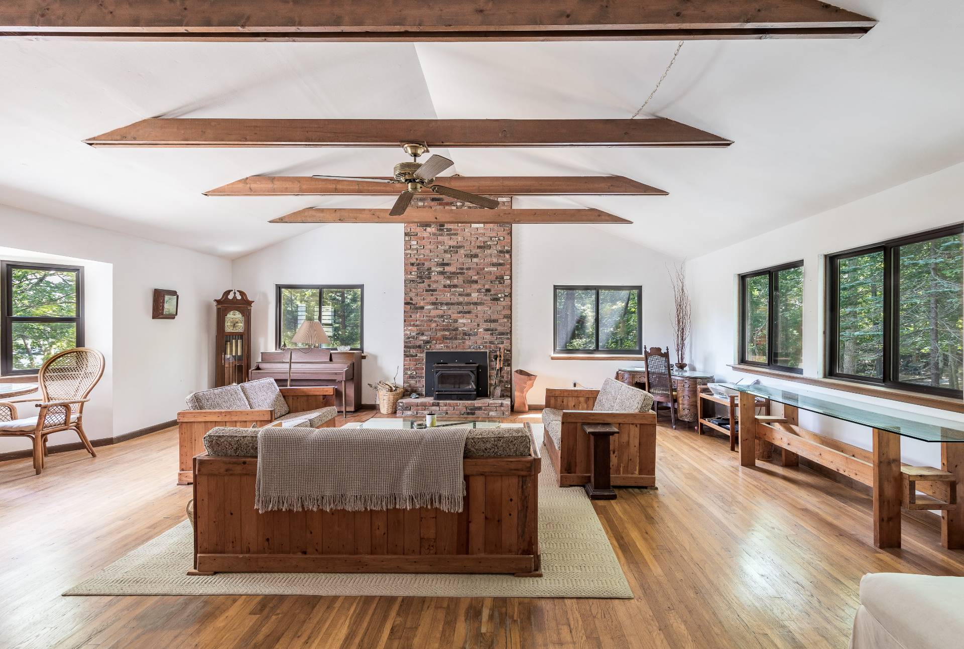 93 Isle Of Wight Road East Hampton, NY 11937 - Photo 5 of 17 a living room with furniture large windows and wooden floor