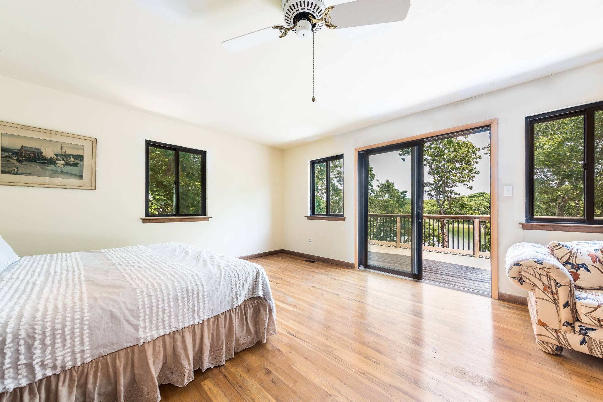 93 Isle Of Wight Road East Hampton, NY 11937 - Photo 10 of 17 a bedroom with a large bed and a large window