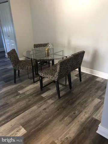 a workspace with furniture and wooden floor