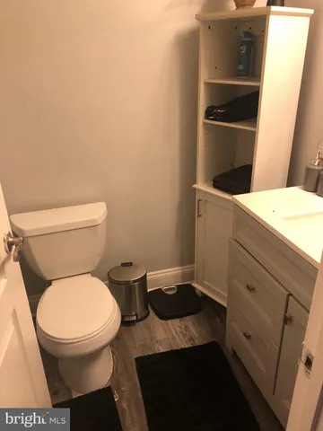 a bathroom with a toilet and a sink