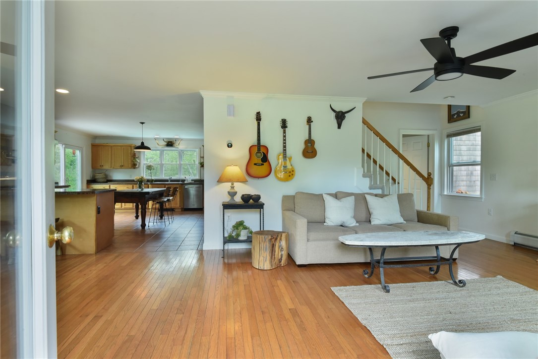 16 Biscuit City Road Richmond, RI 02836 - Photo 3 of 39 As you enter the front door, you are greeted by an open and bright living space with includes the family room with wood-burning stove, the dining area and the gourmet-applianced kitchen