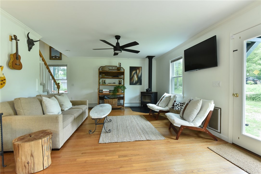 16 Biscuit City Road Richmond, RI 02836 - Photo 5 of 39 The wood-burning stove creates a cozy environment in cooler weather