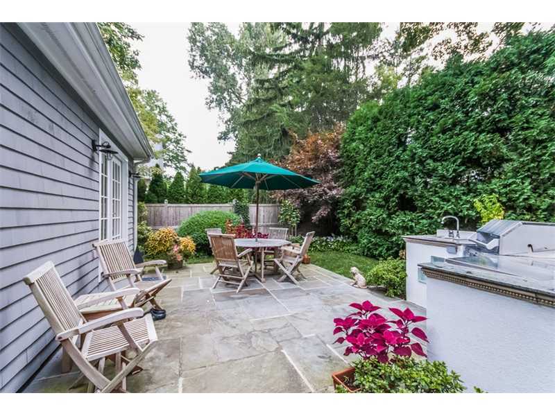8 Milton Place Rowayton, CT 06853 - Photo 16 of 20 a view of backyard with seating space and wooden fence