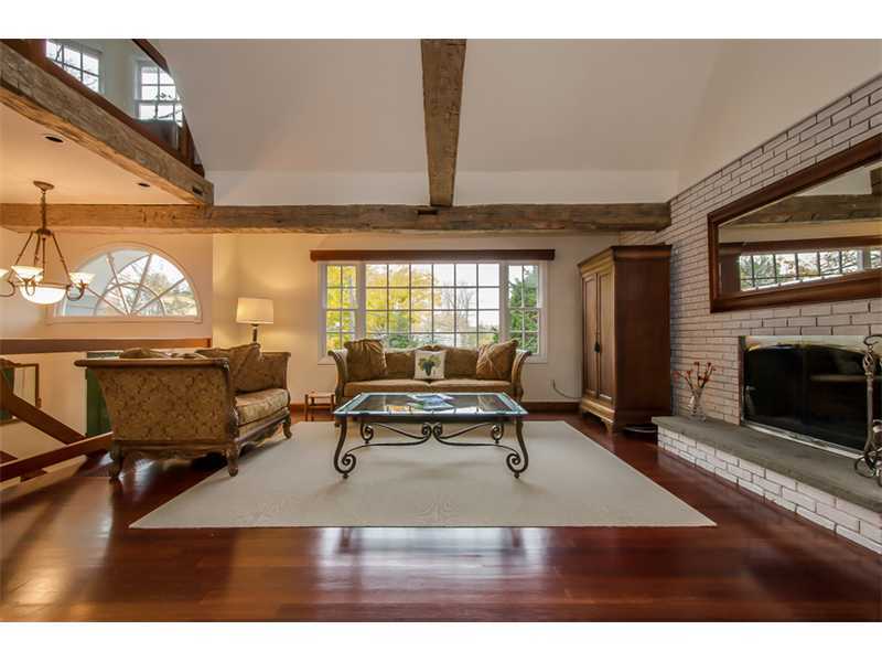 8 Milton Place Rowayton, CT 06853 - Photo 4 of 20 a living room with furniture a window and a fireplace