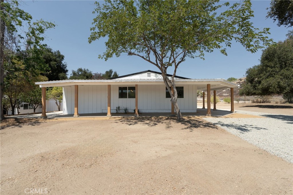 37455 Quarter Valley Road Temecula, CA 92592 - Photo 12 of 64 front view of a house with a trees