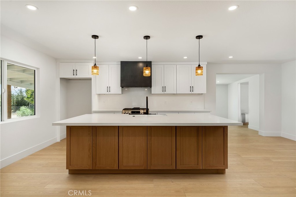 37455 Quarter Valley Road Temecula, CA 92592 - Photo 42 of 64 a kitchen with kitchen island a sink stainless steel appliances and window