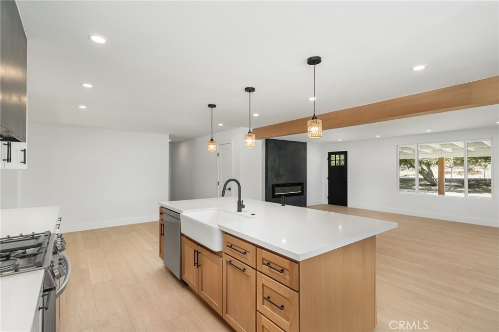 37455 Quarter Valley Road Temecula, CA 92592 - Photo 44 of 64 a view of a kitchen with a sink and a refrigerator