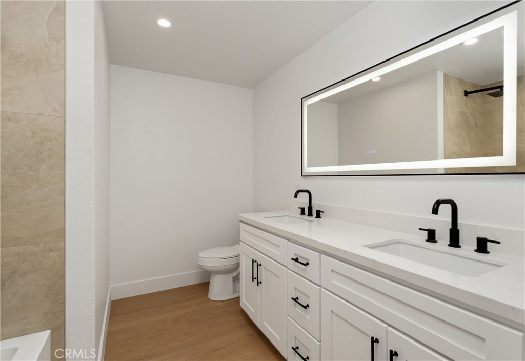 37455 Quarter Valley Road Temecula, CA 92592 - Photo 48 of 64 a bathroom with a toilet sink and mirror