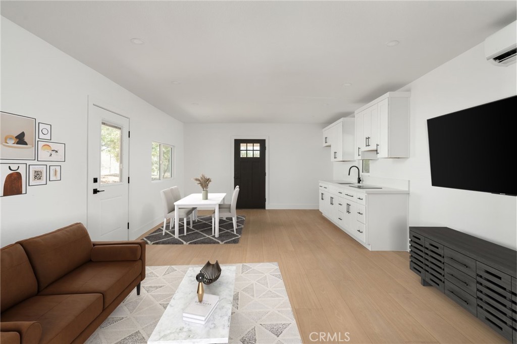 37455 Quarter Valley Road Temecula, CA 92592 - Photo 5 of 64 a living room with furniture and a flat screen tv