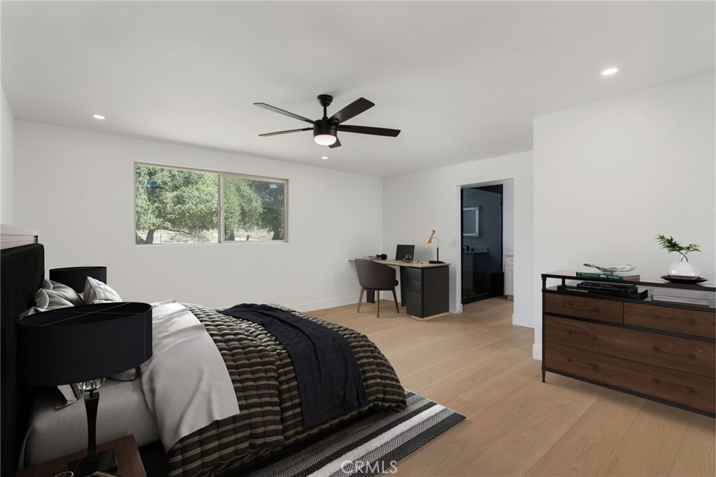 37455 Quarter Valley Road Temecula, CA 92592 - Photo 53 of 64 a bedroom with a bed and a chandelier