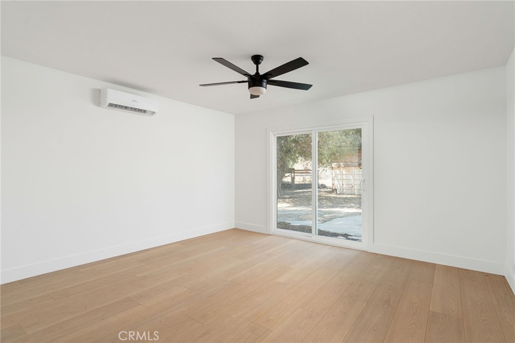 37455 Quarter Valley Road Temecula, CA 92592 - Photo 60 of 64 a view of a livingroom with a ceiling fan and window