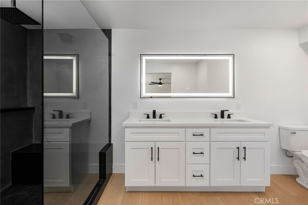 37455 Quarter Valley Road Temecula, CA 92592 - Photo 62 of 64 a bathroom with a sink vanity and mirror