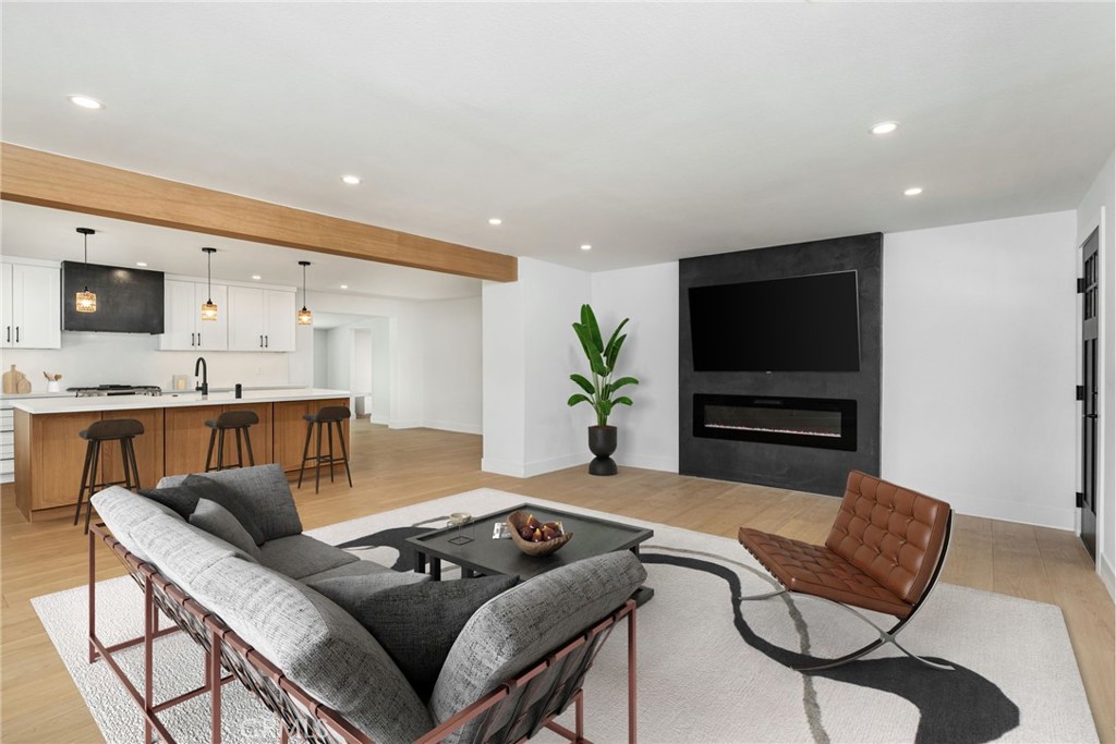 37455 Quarter Valley Road Temecula, CA 92592 - Photo 10 of 64 a living room with furniture and a flat screen tv