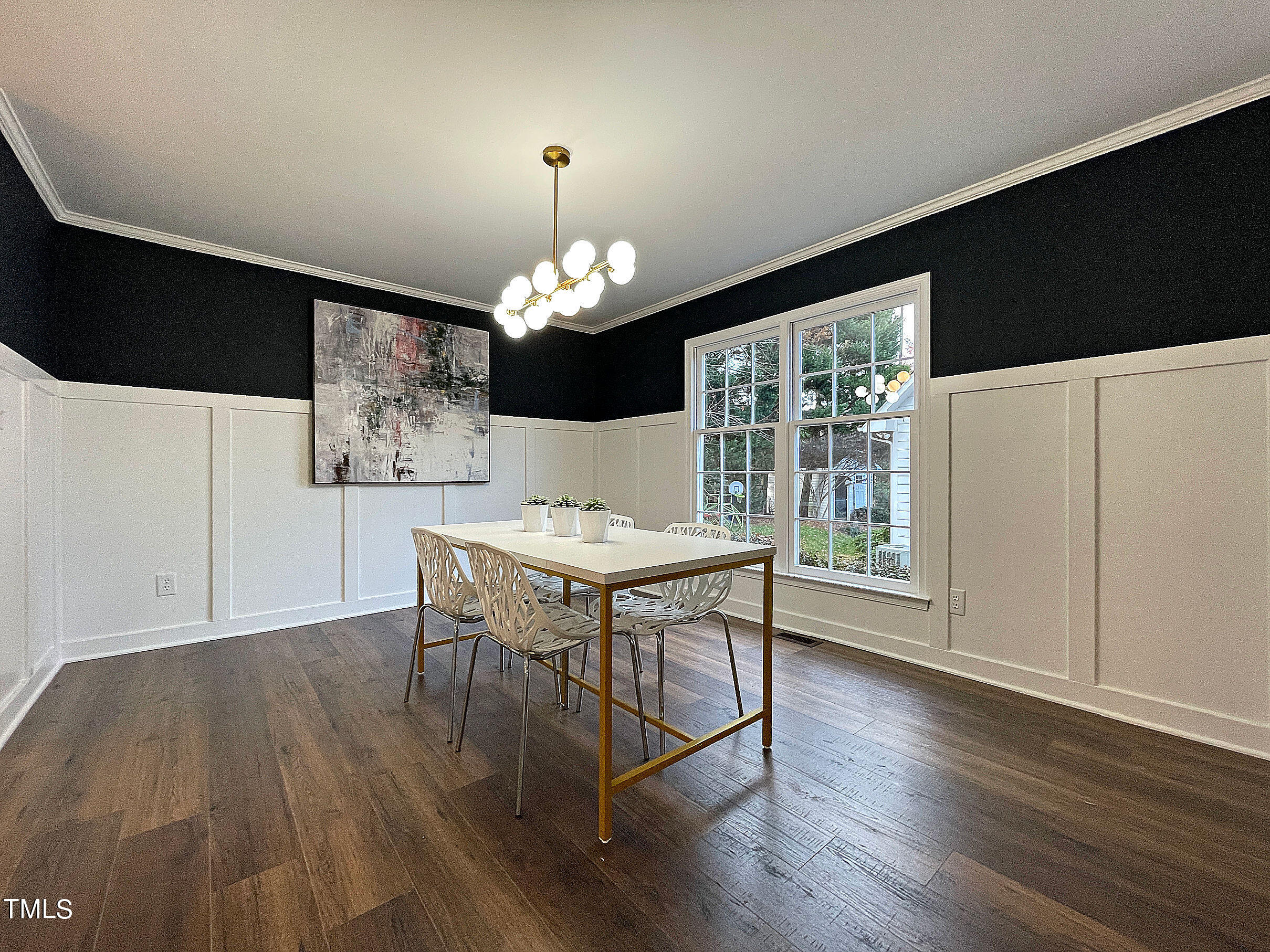 425 Maylands Avenue Raleigh, NC 27615 - Photo 10 of 36 a view of a dining room with furniture wooden floor and chandelier