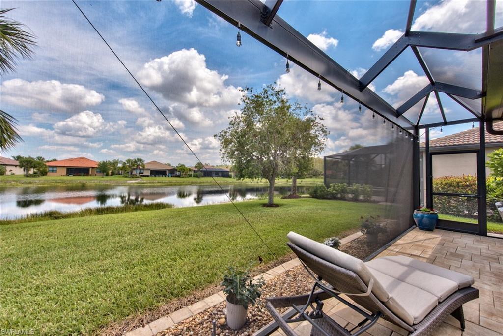 10910 Dennington Road Fort Myers, FL 33913 - Photo 4 of 25 a view of a patio with table and chairs and potted plants