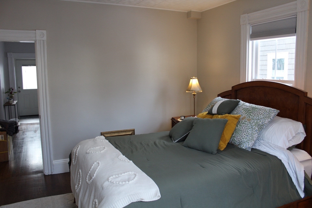 295 Haven Reading Ma, Unit 1 Reading, MA 01867 - Photo 10 of 16 a bedroom with a bed and window