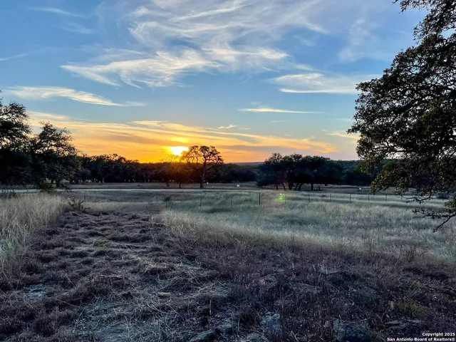 a view of a lake in between the two of trees