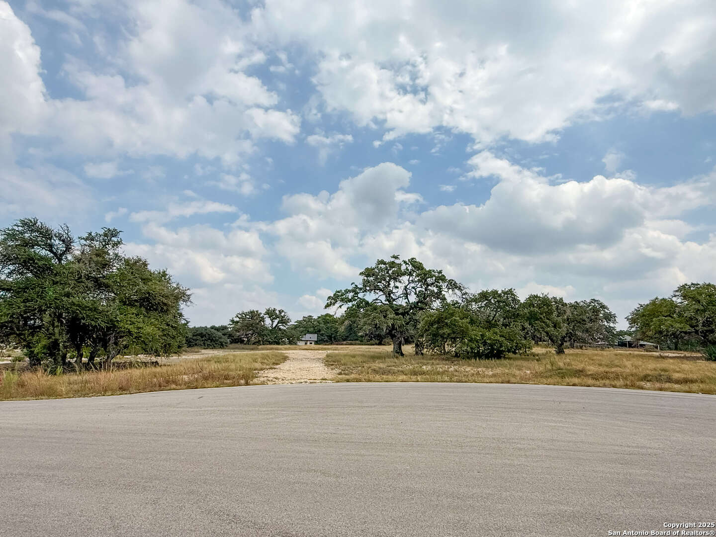 774 Green Gate Bulverde, TX 78163 - Photo 3 of 6 a view of a lake and a yard