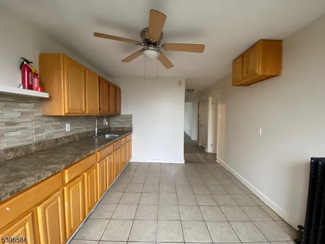 a view of a kitchen with electric appliances