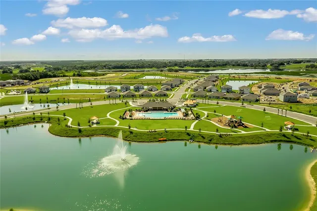 a view of a lake with a big yard