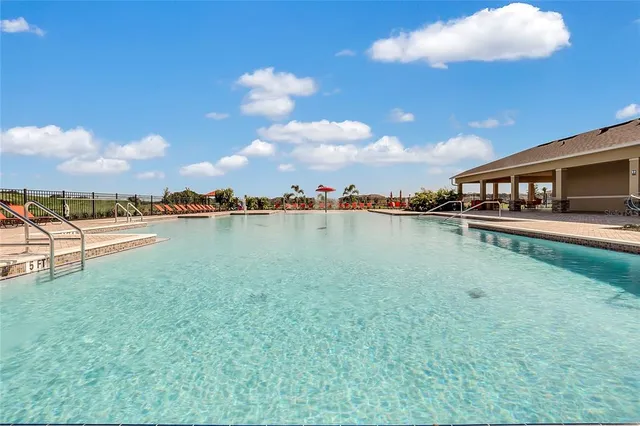 a view of a lake with houses in the back