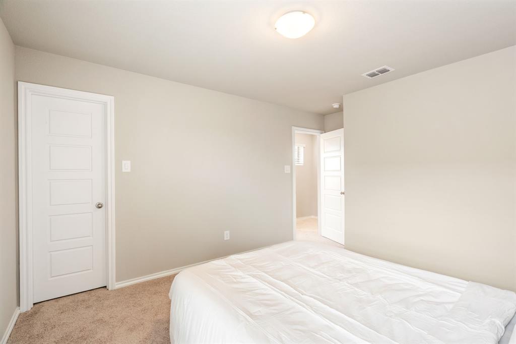321 Pasture Drive Midlothian, TX 76065 - Photo 30 of 40 a bedroom with a bed and a window