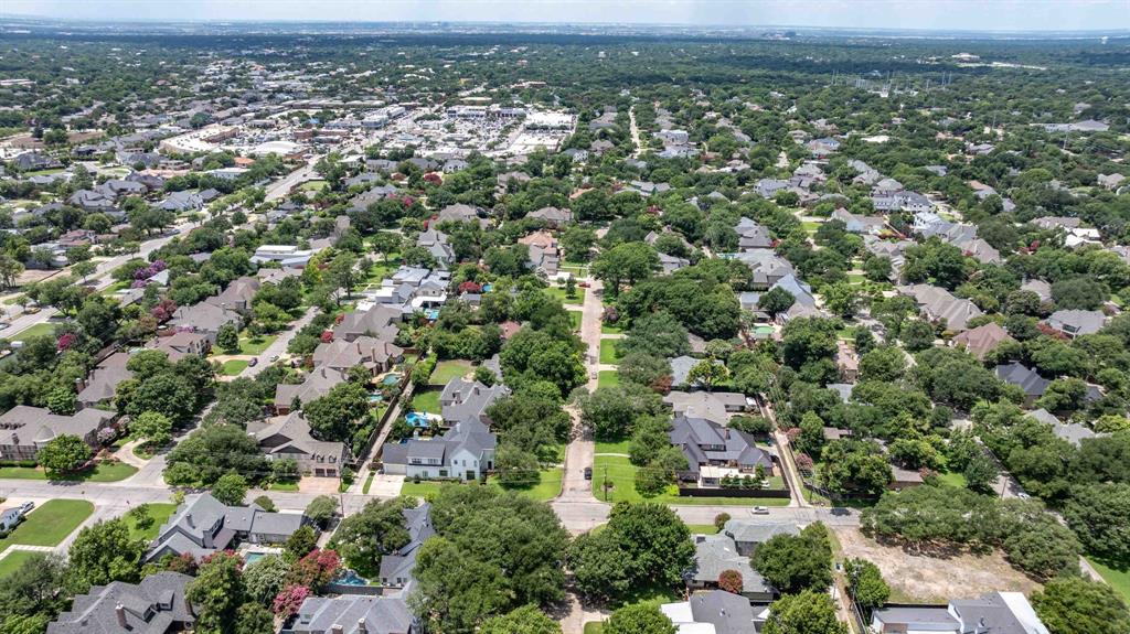 6405 Azalea Lane Dallas, TX 75230 - Photo 11 of 11 an aerial view of residential houses with outdoor space and trees