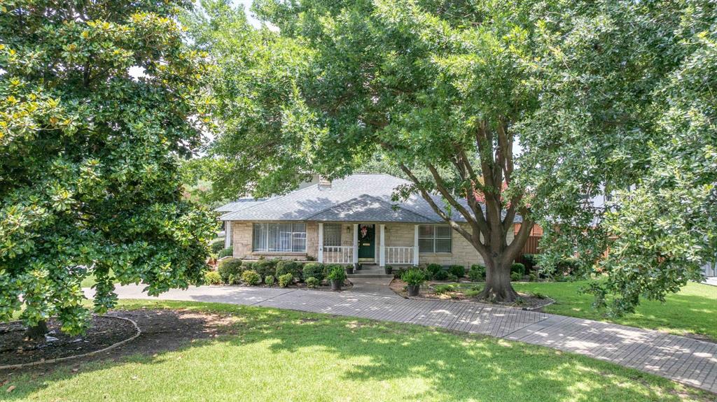 6405 Azalea Lane Dallas, TX 75230 - Photo 5 of 11 a front view of a house with yard and green space