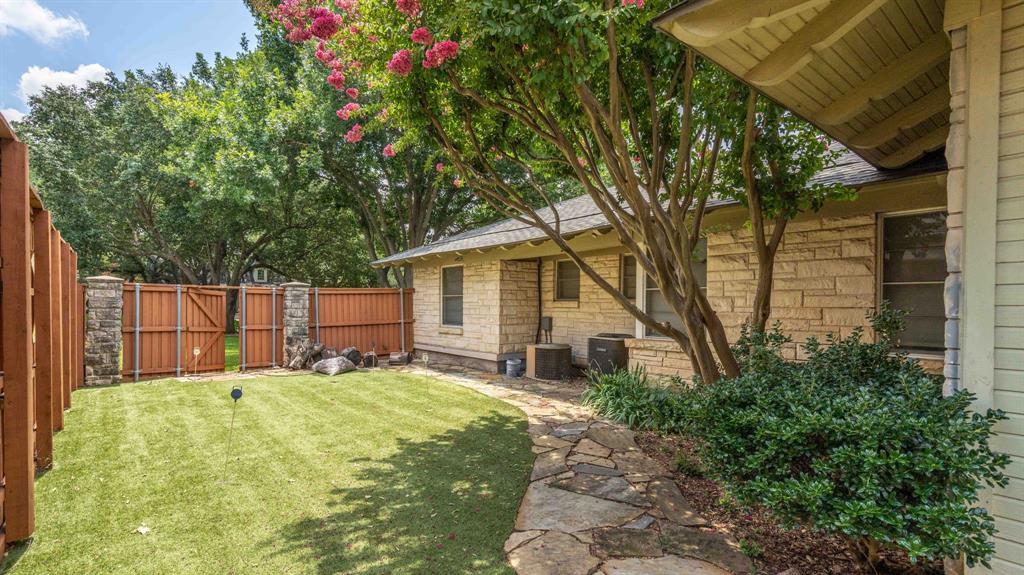 6405 Azalea Lane Dallas, TX 75230 - Photo 8 of 11 a house that has a tree in front of it
