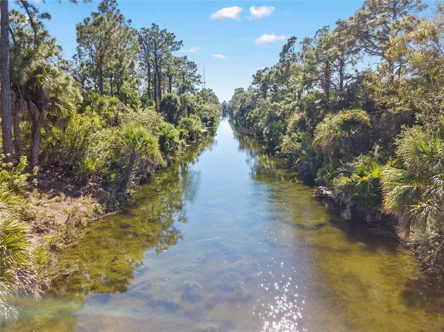 a view of a lake with a yard