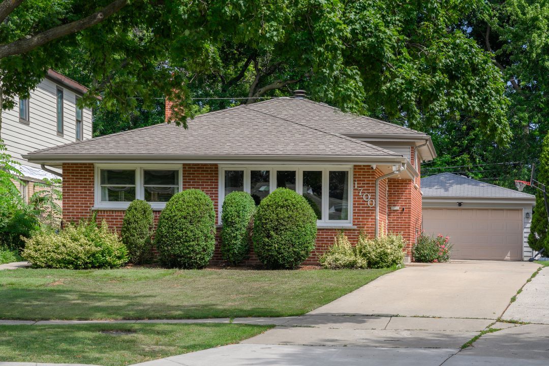 1700 Marvin Parkway Park Ridge, IL 60068 - Photo 1 of 26 a front view of a house with a garden
