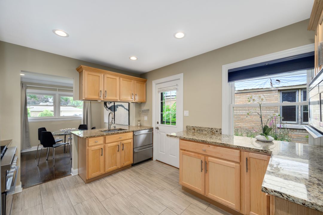 1700 Marvin Parkway Park Ridge, IL 60068 - Photo 11 of 26 a kitchen with a stove a sink and a refrigerator