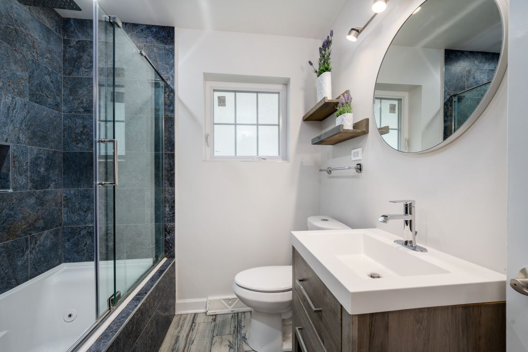 1700 Marvin Parkway Park Ridge, IL 60068 - Photo 16 of 26 a bathroom with a sink a toilet and a mirror