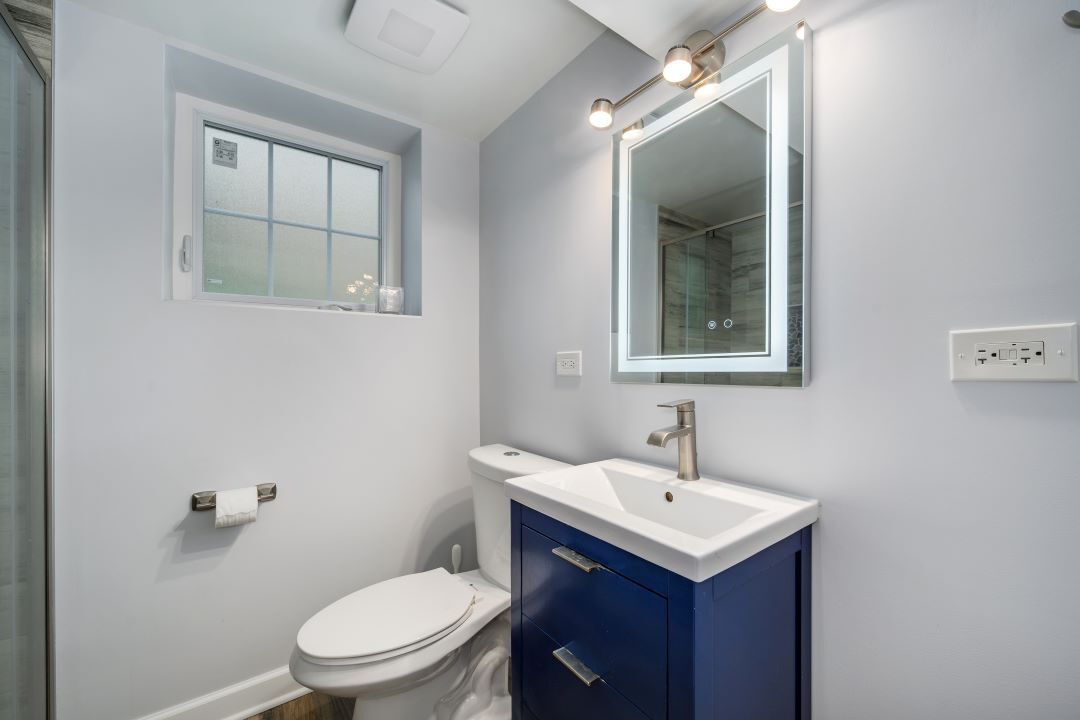 1700 Marvin Parkway Park Ridge, IL 60068 - Photo 21 of 26 a bathroom with a sink a toilet and shower