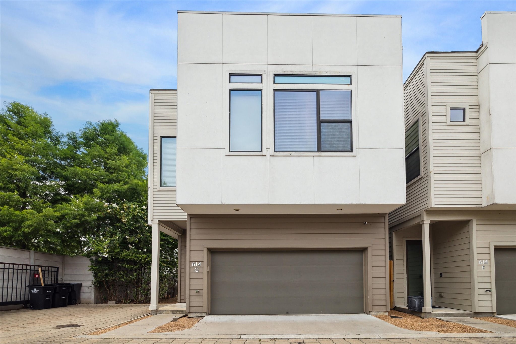 a front view of a house with a garage