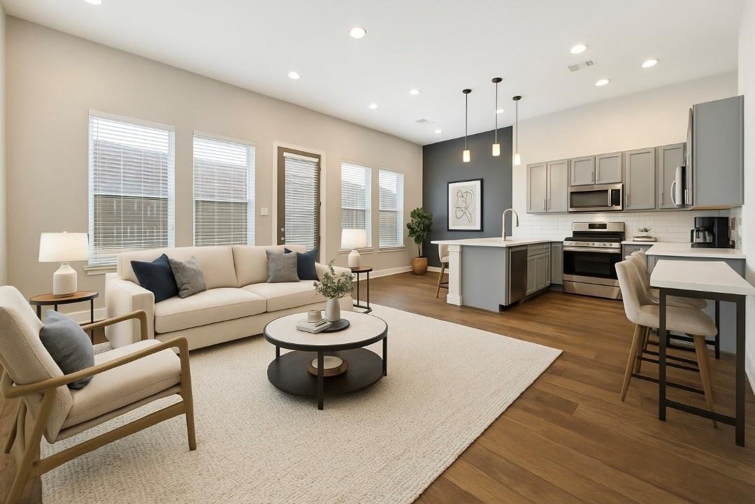 614 Thornton Road, Unit G Houston, TX 77018 - Photo 4 of 18 a living room with furniture kitchen view and a large window