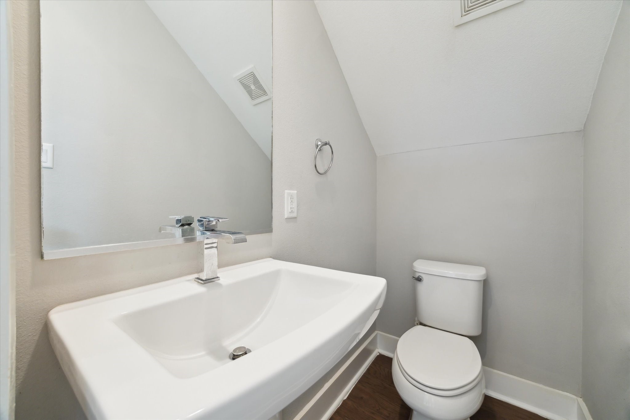 614 Thornton Road, Unit G Houston, TX 77018 - Photo 10 of 18 a white toilet sitting next to a bathroom sink