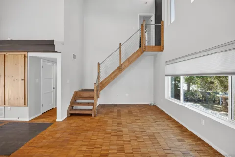 a view of an empty room with a fireplace