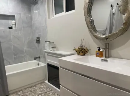 a bathroom with a bathtub and a sink