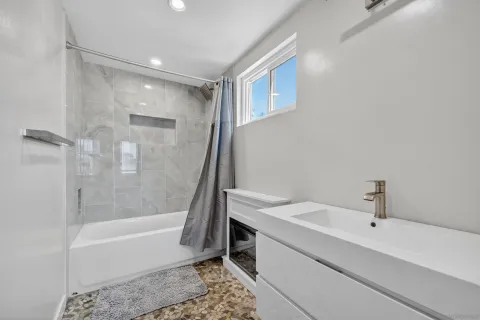 a bathroom with a toilet and a bathtub