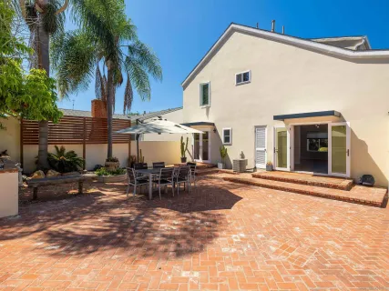 a view of a backyard with swimming pool