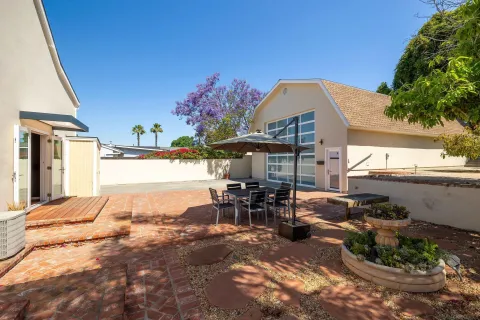 a bedroom with furniture and a chandelier