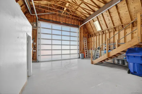 a view of a livingroom with furniture and garage