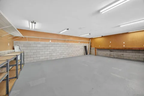 a view of a backyard with chairs and a stove