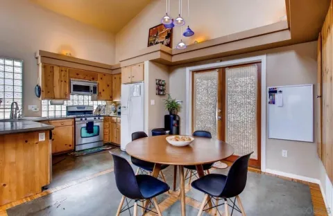 a view of a dining room with furniture window and outside view