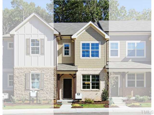 764 Wickham Ridge Road, Unit 108 Apex, NC 27539 - Photo 1 of 20 a front view of a house with a yard