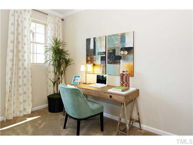 764 Wickham Ridge Road, Unit 108 Apex, NC 27539 - Photo 13 of 20 a dining room with furniture and wooden floor