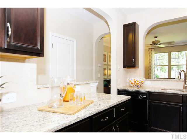 764 Wickham Ridge Road, Unit 108 Apex, NC 27539 - Photo 5 of 20 a bathroom with a sink and a mirror